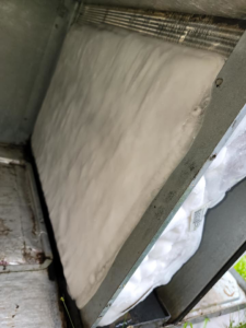 A frozen HVAC filter or coil inside a unit, indicating a problem for HD Mechanical Services in Buena Park, CA