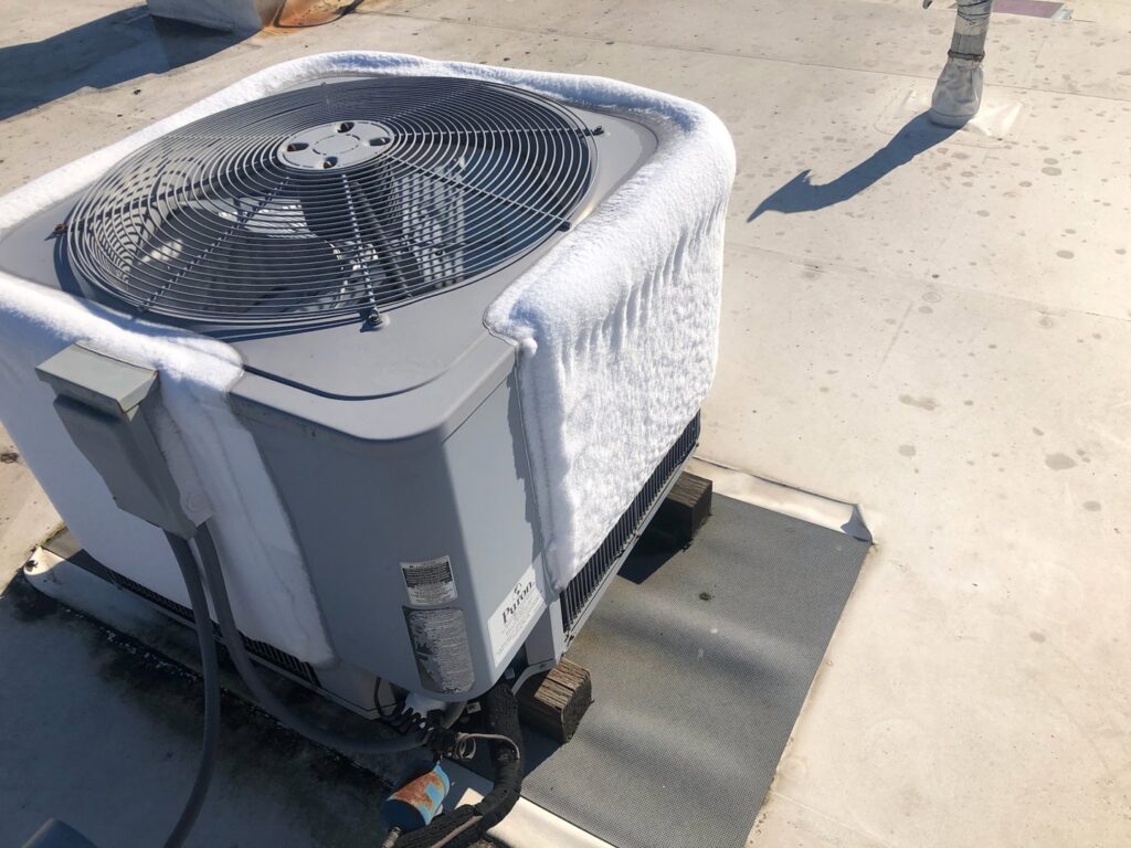 A frozen outdoor air conditioning unit requiring repair or defrosting service from Awesome Air Heating and Cooling LLC in Corvallis, OR.