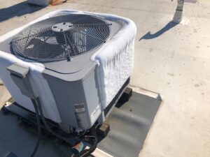A frozen outdoor air conditioning unit requiring repair or defrosting service from Awesome Air Heating and Cooling LLC in Corvallis, OR.