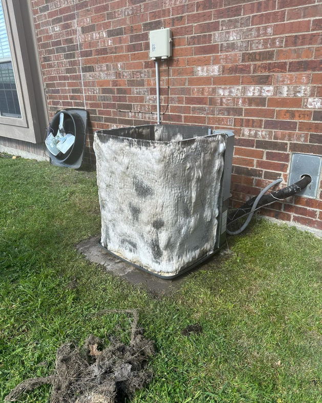 A frozen outdoor AC unit requiring repair by CLM Mechanical in Dallas, TX