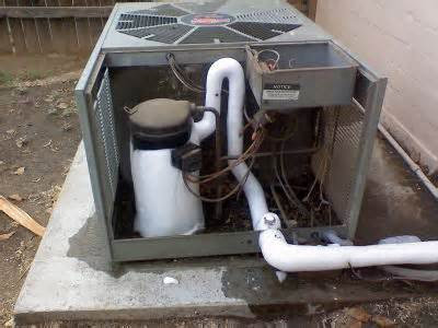 A frozen outdoor air conditioning unit indicating a problem requiring service from Vision Air Services in Tulsa, OK.