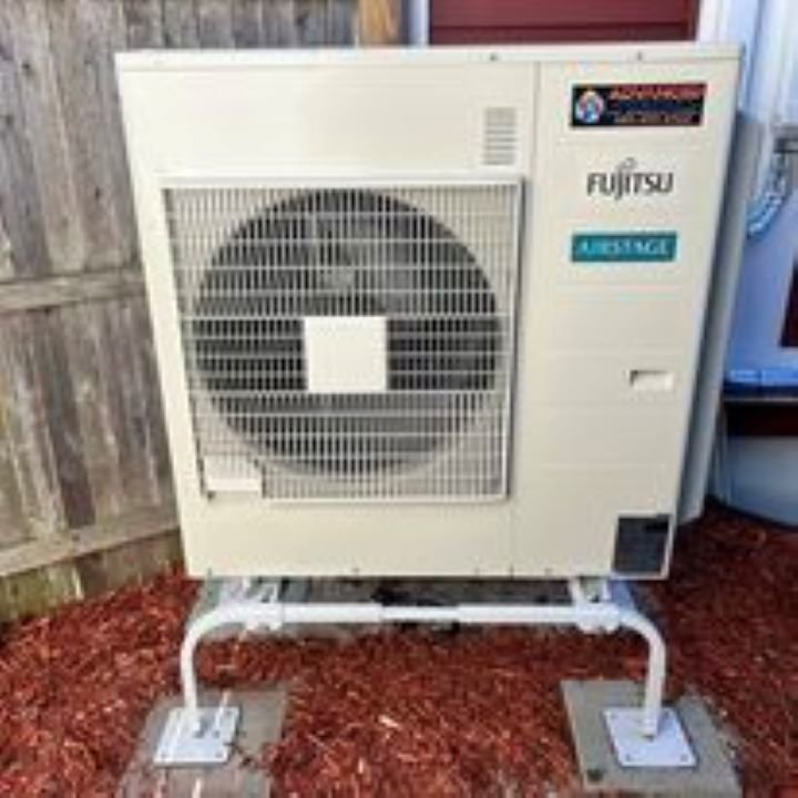 An outdoor Fujitsu Airstage heat pump unit professionally installed by Advanced Comfort LLC in Concord, NH.