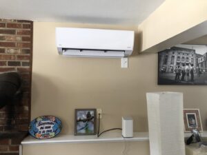 An indoor Fujitsu mini-split air conditioning unit installed on a wall in a home by Garrison City HVACR in Dover, NH