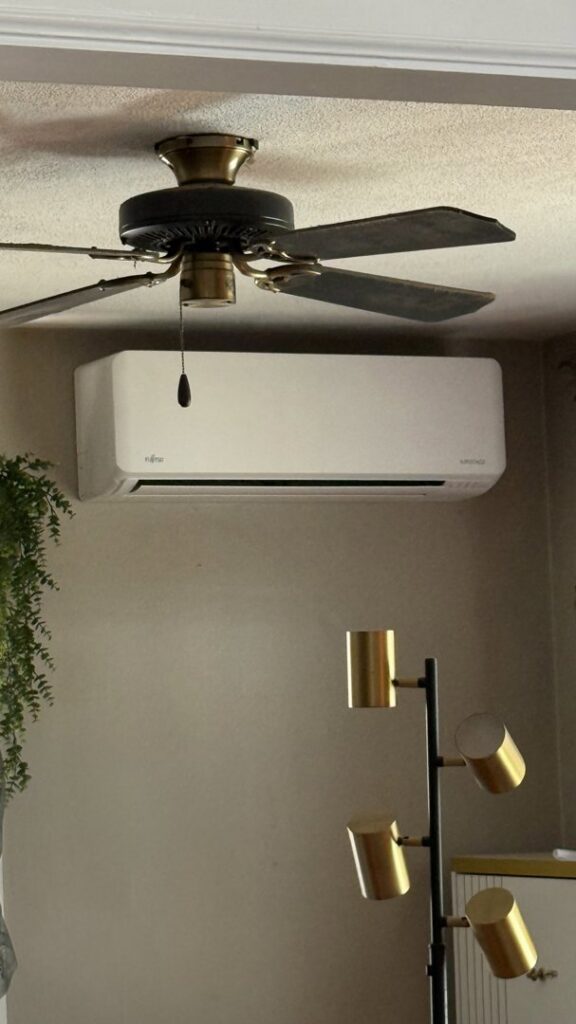 A Fujitsu mini-split indoor unit installed on a wall by Wood's Heating Service in Tiverton, RI