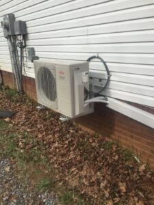 A Fujitsu mini-split outdoor unit professionally installed on a home by Johnson's Heating and Cooling in Clarksville, TN.
