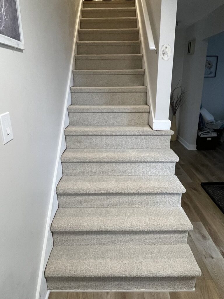 Full staircase with new carpet installation by Mendez Carpet in Grand Rapids, MI.
