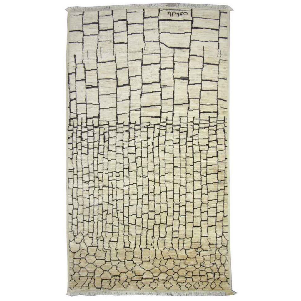 A full view of a modern geometric block pattern rug with fringe, available from Legacy Looms in Minneapolis, MN.