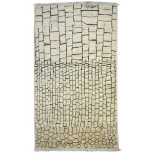 A full view of a modern geometric block pattern rug with fringe, available from Legacy Looms in Minneapolis, MN.