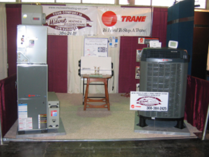 An indoor furnace and outdoor air conditioning unit on display by Midwest Heating & Air Conditioning in Grand Island, NE.