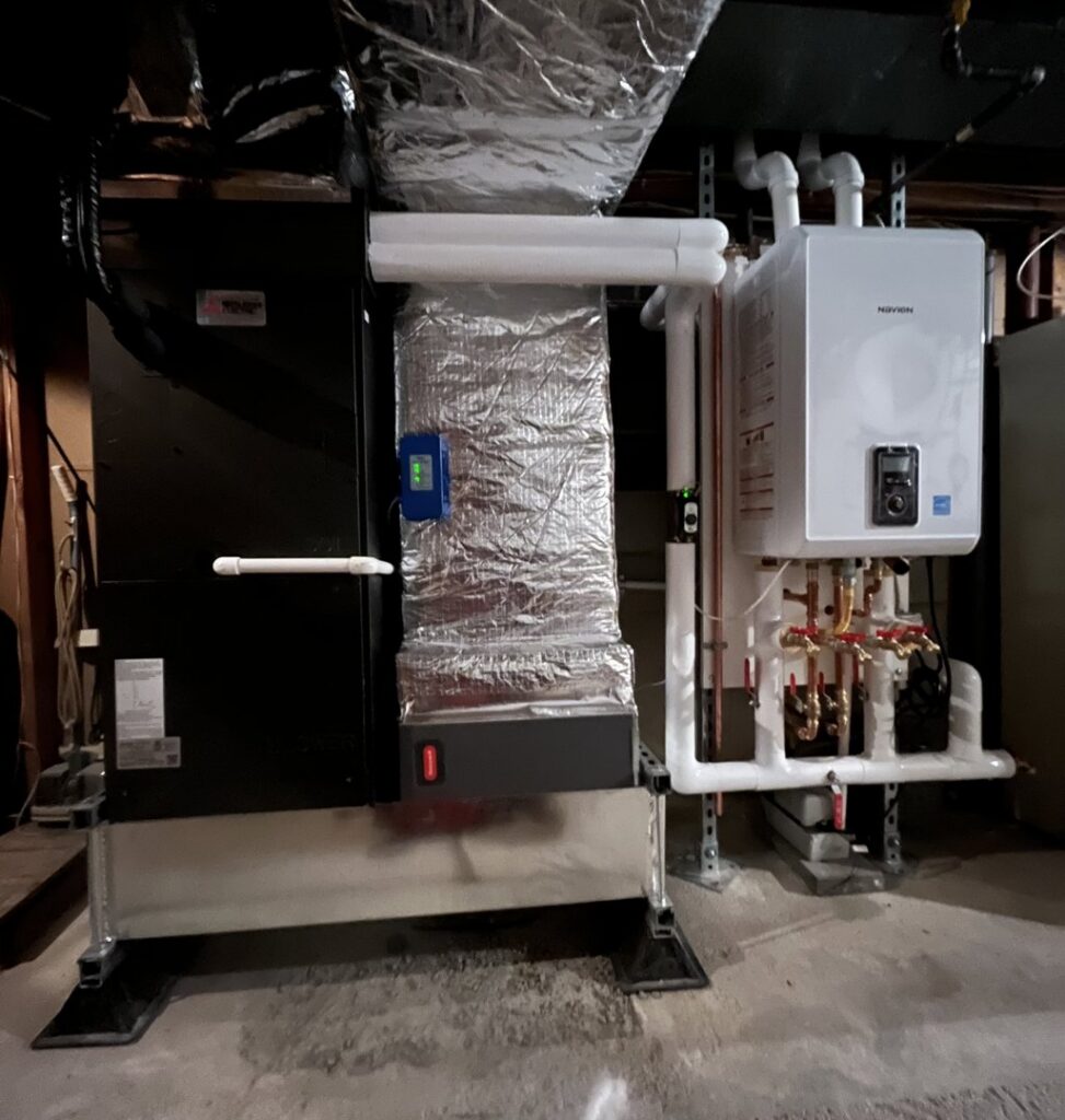 A furnace and air handler unit installed in a residential basement by Dane HVAC in Willowbrook, IL.