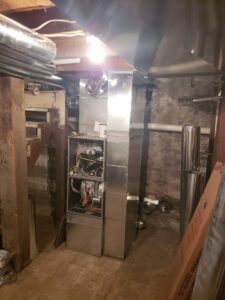 A furnace and air handler unit with extensive ductwork installed in a utility room by Jv Services inc. in Pinellas Park, FL.