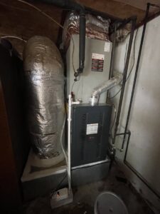 A furnace or air handler unit with flexible ductwork installed by Elite Home Comfort in Clarksville, TN
