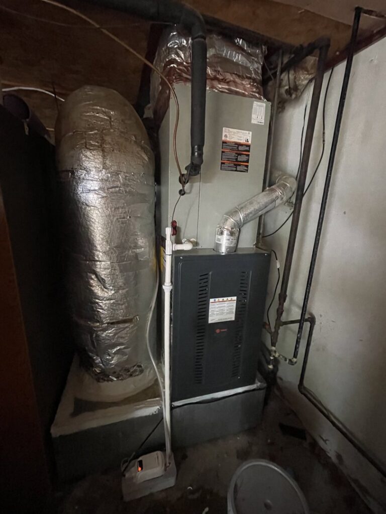 A furnace or air handler unit with flexible ductwork installed by Elite Home Comfort in Clarksville, TN