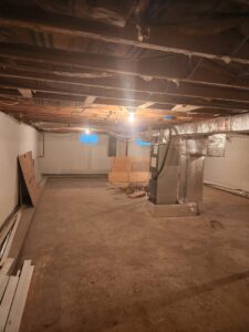 New furnace and air handler unit with ductwork installed in a basement by Duct Pros in Martinsburg, WV