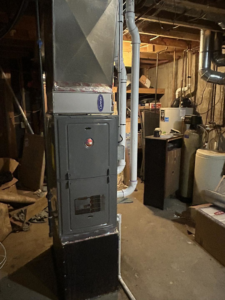 A new furnace and air handler unit with ductwork installed in a basement by BRY Heat and Air in Elgin, MN