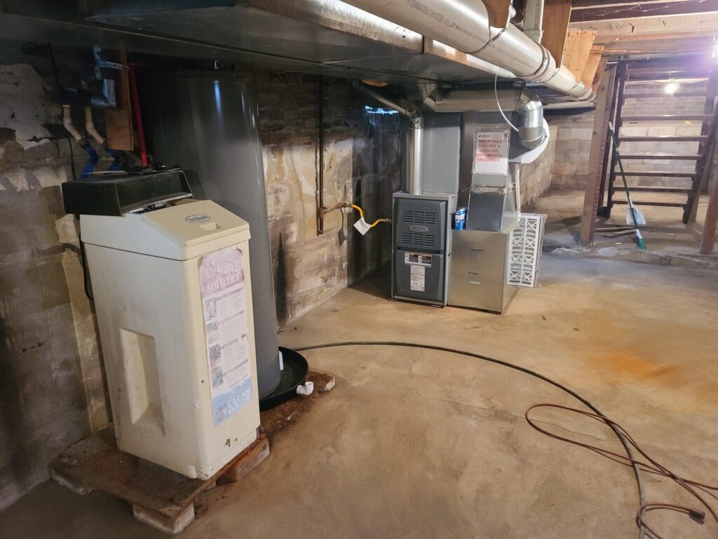 A furnace and air handler unit installed in a basement by McElroy Service Experts in Grand Island, NE.