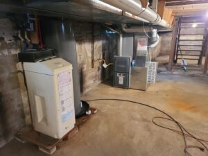 A furnace and air handler unit installed in a basement by McElroy Service Experts in Grand Island, NE.