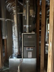 An indoor furnace and air handler unit with ductwork installed by Oklahoma Climate Solutions in Oklahoma City, OK.