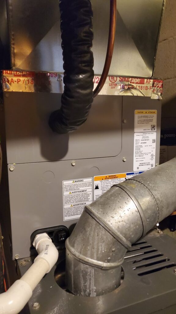 A furnace and air handler unit with ductwork installed by R. Davis Mechanical in Pittsburgh, PA