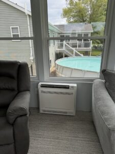 A new furnace or air handler unit suspended from the ceiling in an unfinished space, installed by TruLine HVAC in Cedar Rapids, IA.