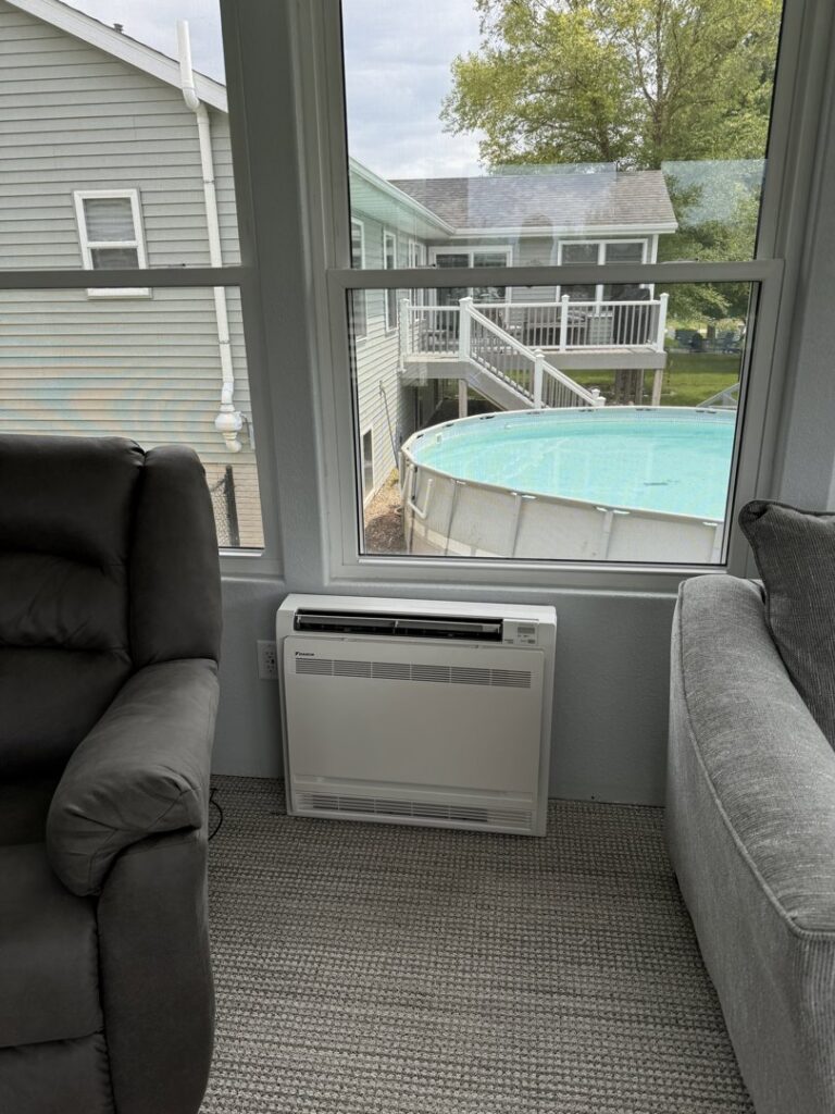 A new furnace or air handler unit suspended from the ceiling in an unfinished space, installed by TruLine HVAC in Cedar Rapids, IA.