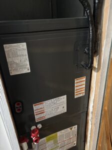 A close-up side view of a furnace or air handler unit during installation or service by A's Heating and Cooling LLC in Portland, OR.