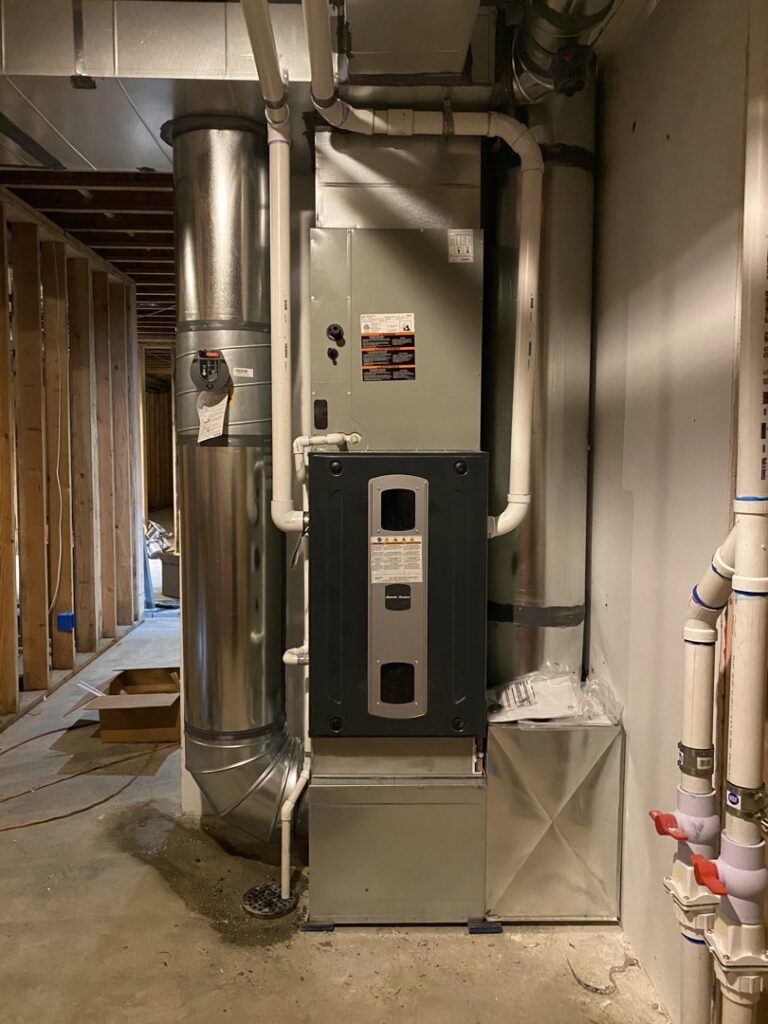 A new furnace with an attached air purifier and ductwork installed during construction by Climate Control Experts HVAC LLC in Federal Way, WA