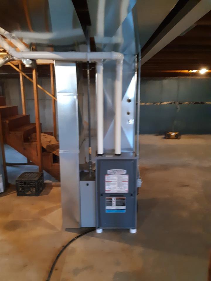A new furnace and associated ductwork installed in a basement by Air Doctors Heating and Air Conditioning in Kenosha, WI.