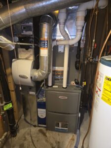 A modern furnace and whole-house humidifier installation with ductwork by Cyber Heating and Cooling in Bloomington, MN.
