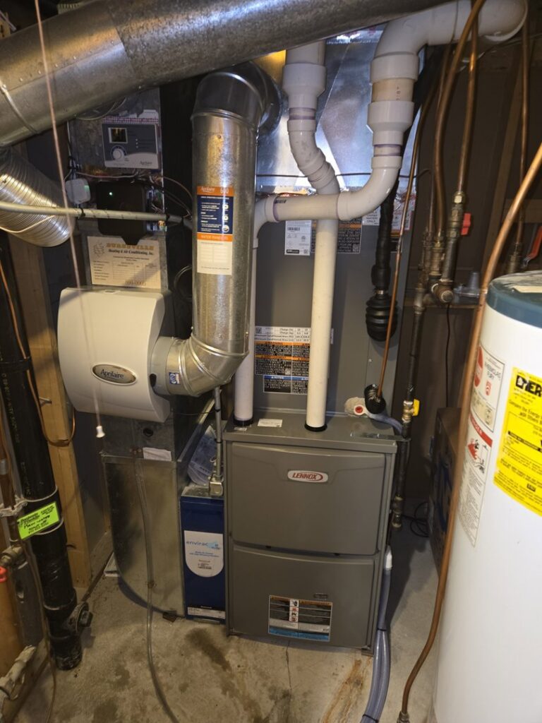 A modern furnace and whole-house humidifier installation with ductwork by Cyber Heating and Cooling in Bloomington, MN.