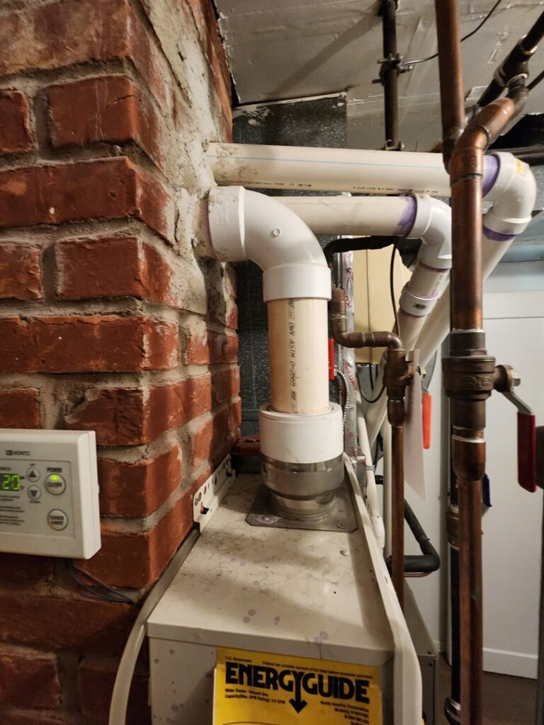 A furnace and associated piping system, part of HVAC services by Delta Clean Air in Boston, MA