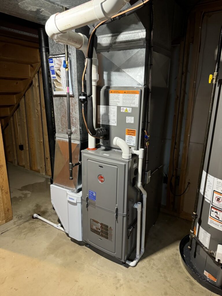 A new furnace and water heater system installed in a basement by My HVAC Guy in North Canton, OH.