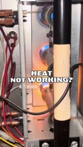 Close-up view of furnace burner flames during a heating system check by Mammoth Heating in Wasilla, AK.