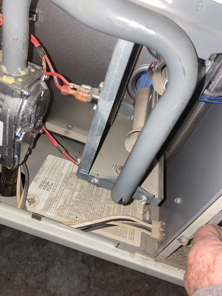 Close-up of a furnace burner during an inspection by 32 Degrees Heating and Air Conditioning in Las Vegas, NV