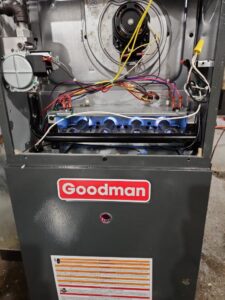 A furnace with its burners lit, demonstrating proper operation after service by Total HVAC - Heating and Cooling in Nashville, TN.