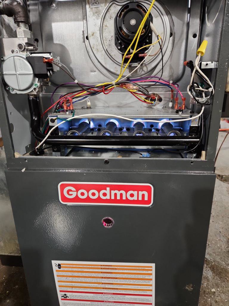A furnace with its burners lit, demonstrating proper operation after service by Total HVAC - Heating and Cooling in Nashville, TN.