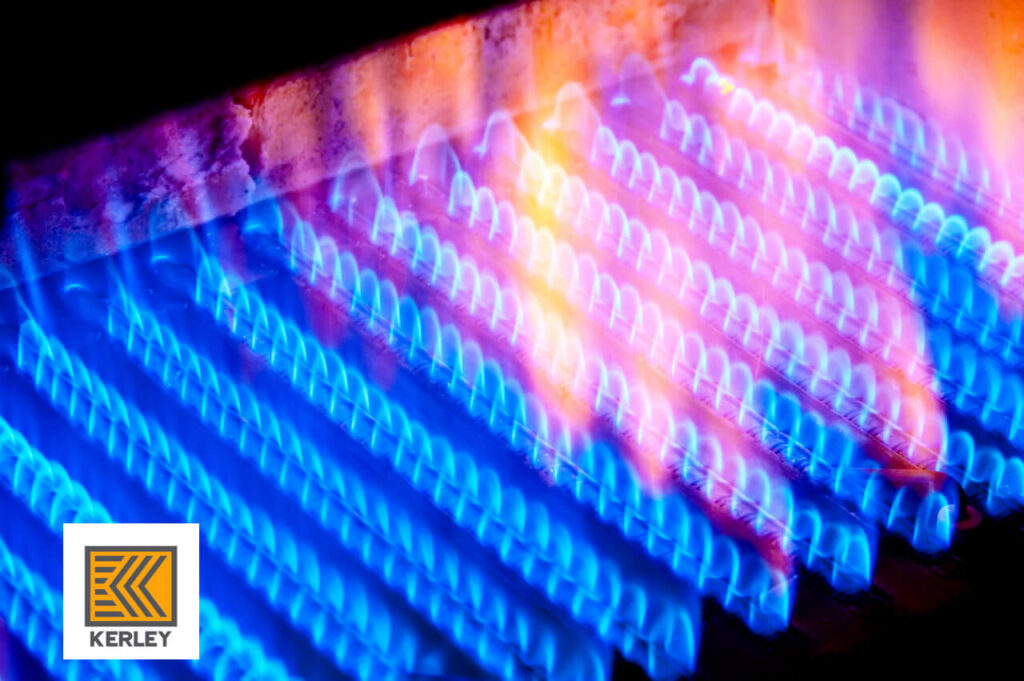 Close-up of furnace burners with vibrant blue and orange flames, indicating efficient heating by Kerley Heating & Cooling in Rock City, IL