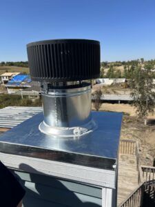 A newly installed furnace chimney vent on a roof by Sandys Heating & Air in Papillion, NE.