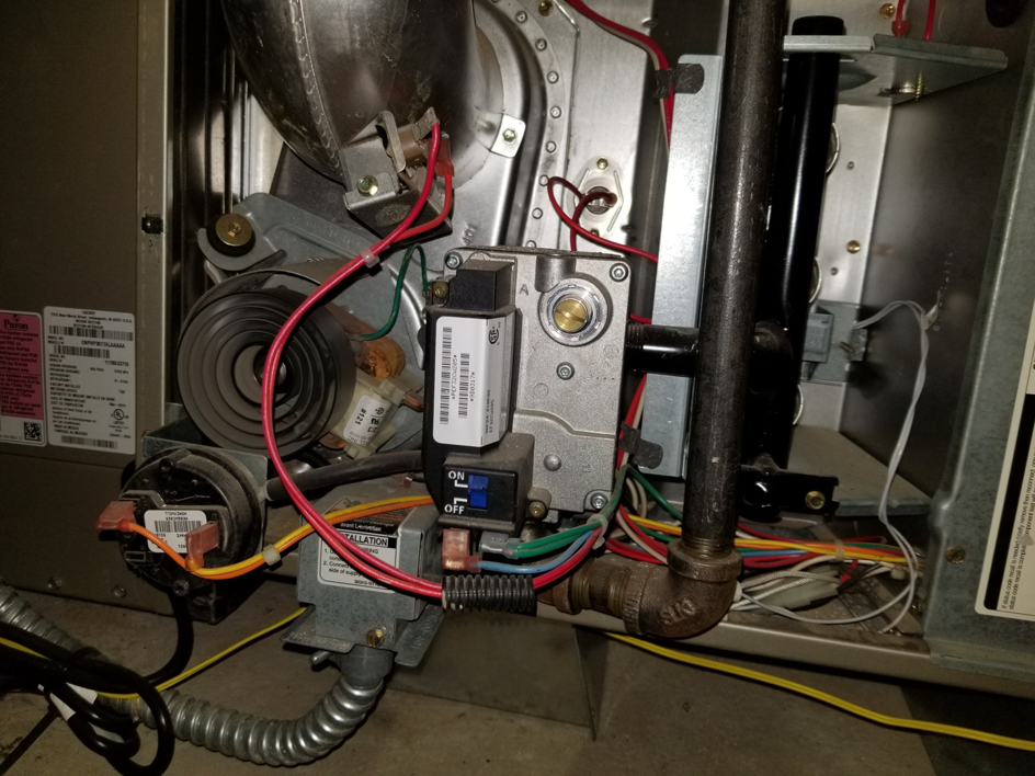 Close-up view of furnace internal components serviced by EPCTL Heating and Cooling in Byers, CO.