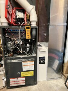 A furnace undergoing diagnostic testing with an air purifier, serviced by Golden Heating and Air LLC in Arvada, CO.