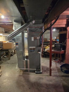 Close-up of furnace and ductwork connections installed by Black Tie Home Services in Springfield, IL