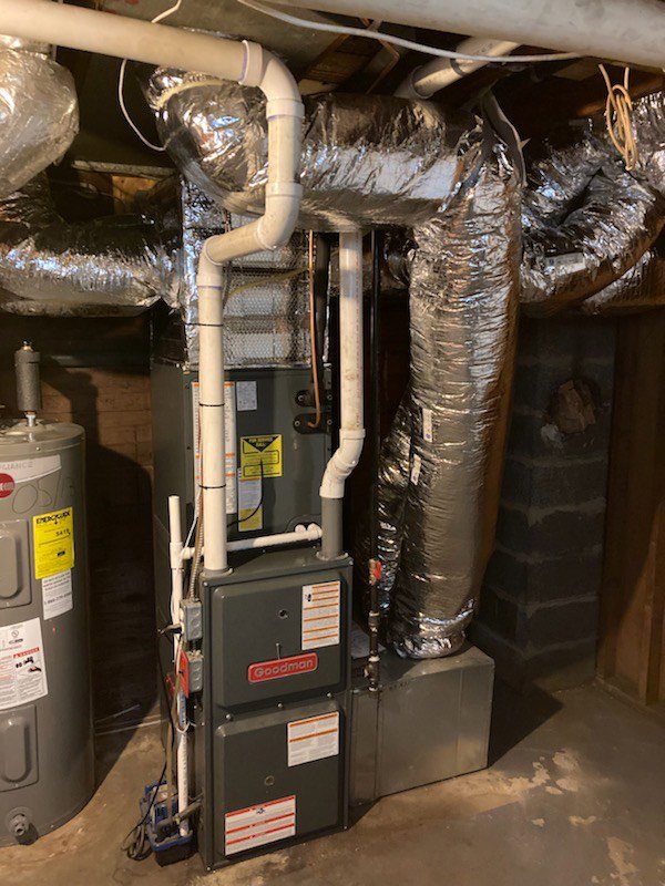 A Goodman furnace and extensive ductwork installation in a basement by Evergreen Services in Warwick, RI.