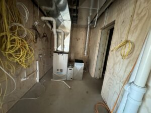 A furnace and new ductwork installed in a utility room during new construction by Dischler Heating-Cooling & Fireplaces in Prairie du Sac, WI.