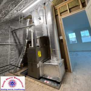 A new furnace and ductwork installation in a residential building by South Shore Mechanical in Abington, MA