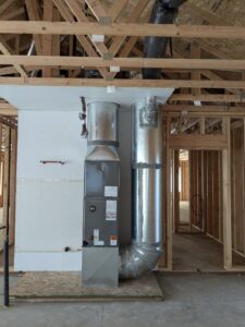 A furnace and ductwork installation in a new construction home by Kingdom Heating and Air in Sacramento, CA.