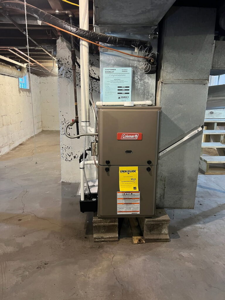 A modern furnace unit installed in a basement by Furnace Doctors Heating & Air Conditioning LLC in Champaign, IL