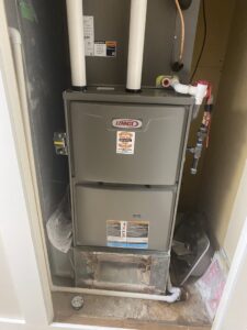 A Lennox furnace and ductwork installed in a utility closet by Crome Mechanical Inc. in Cedar Springs, MI