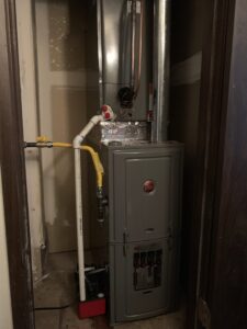 A furnace unit installed in a closet by Paul's Heating & Air Conditioning in Virginia Beach, VA.