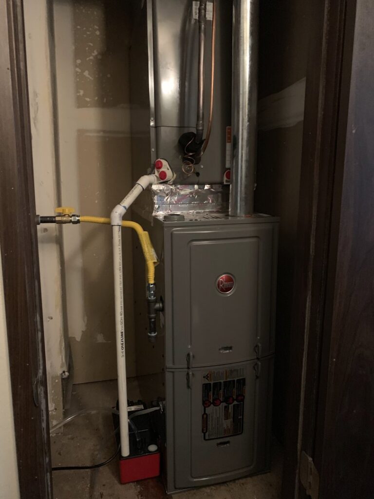 A furnace unit installed in a closet by Paul's Heating & Air Conditioning in Virginia Beach, VA.