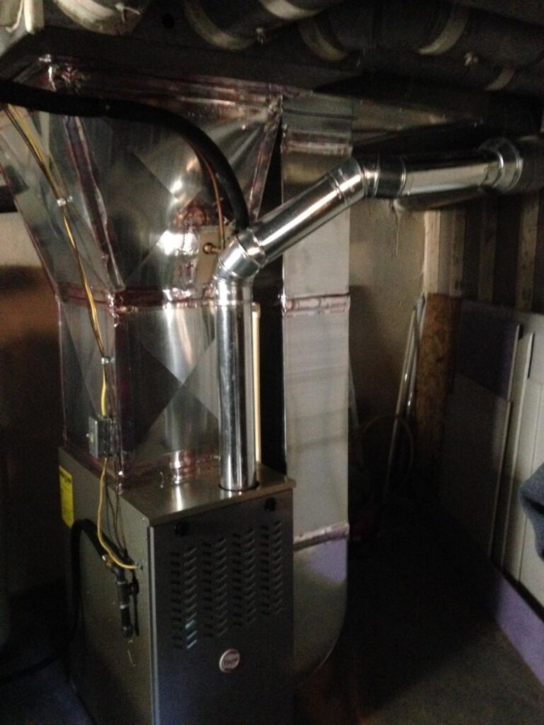 A modern furnace unit with new ductwork and exhaust piping installed by David J. Winston Co. in Erie, PA.